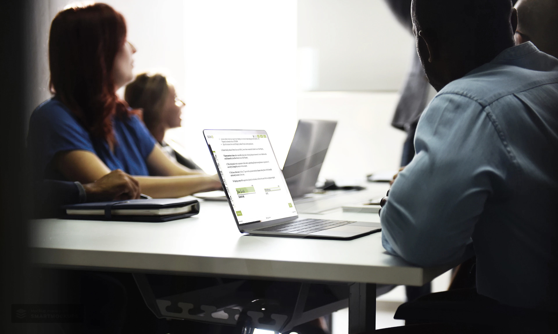 smartmockups-laptop-meeting-room